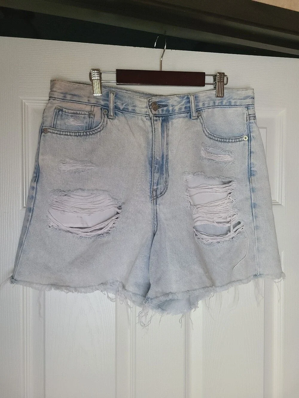 American Eagle Ripped Denim Baggy Mom Shorts in a light wash.